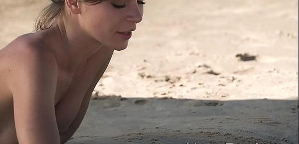  Exotic cutie Natalia playing on a sandy beach